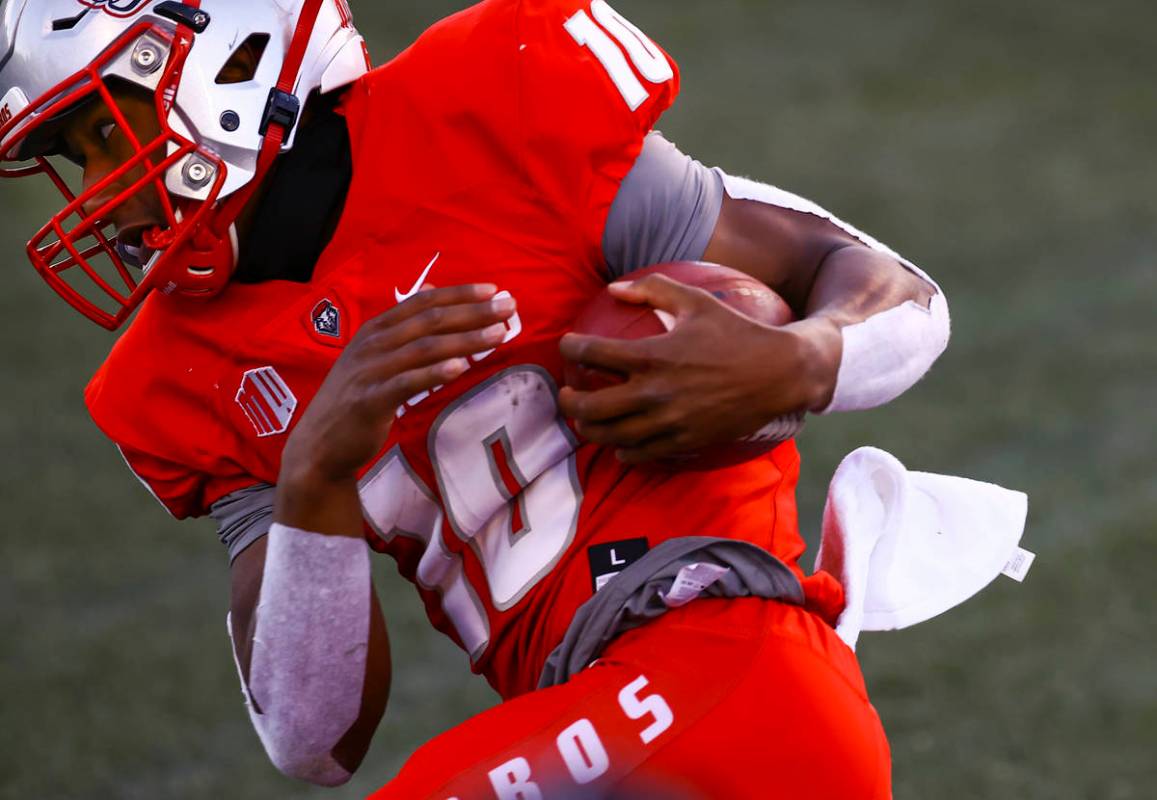 New Mexico Lobos quarterback Trae Hall (10) runs the ball against UNR during the first half of ...