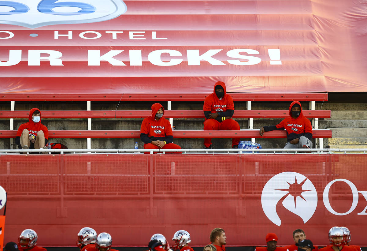 New Mexico Lobos players watch from the stands during the first half of a football game against ...