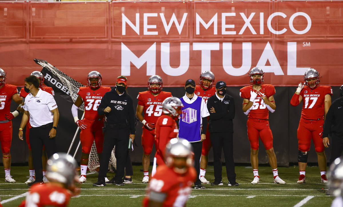 New Mexico Lobos players and staff look on as they play UNR during the second half of a footbal ...