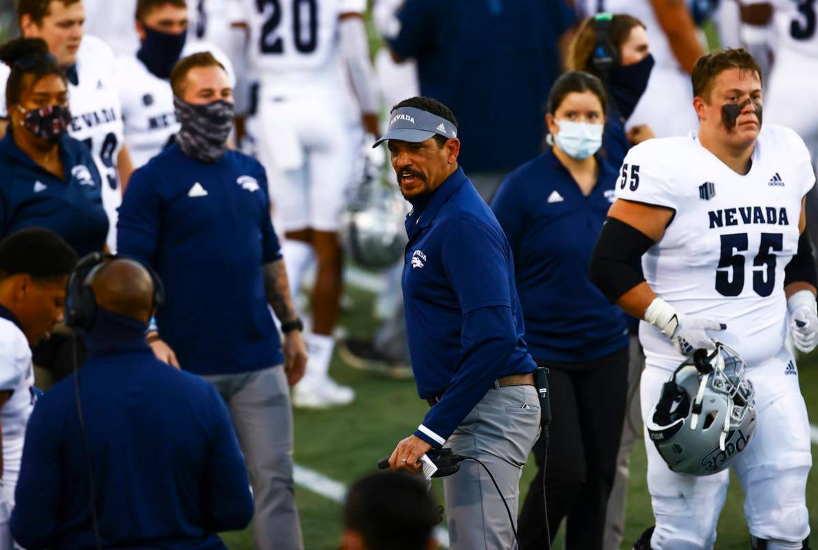 UNR Wolf Pack head coach Jay Norvell shouts toward a player during the first half of a football ...