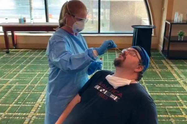 Adam Hill takes his first COVID test back in May at a UFC event in Jacksonville. (Las Vegas Rev ...