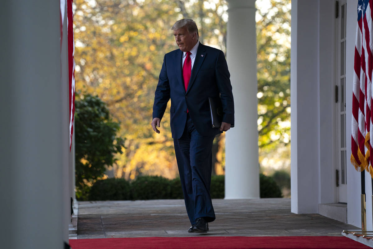 President Donald Trump arrives to speak in the Rose Garden of the White House, Friday, Nov. 13, ...