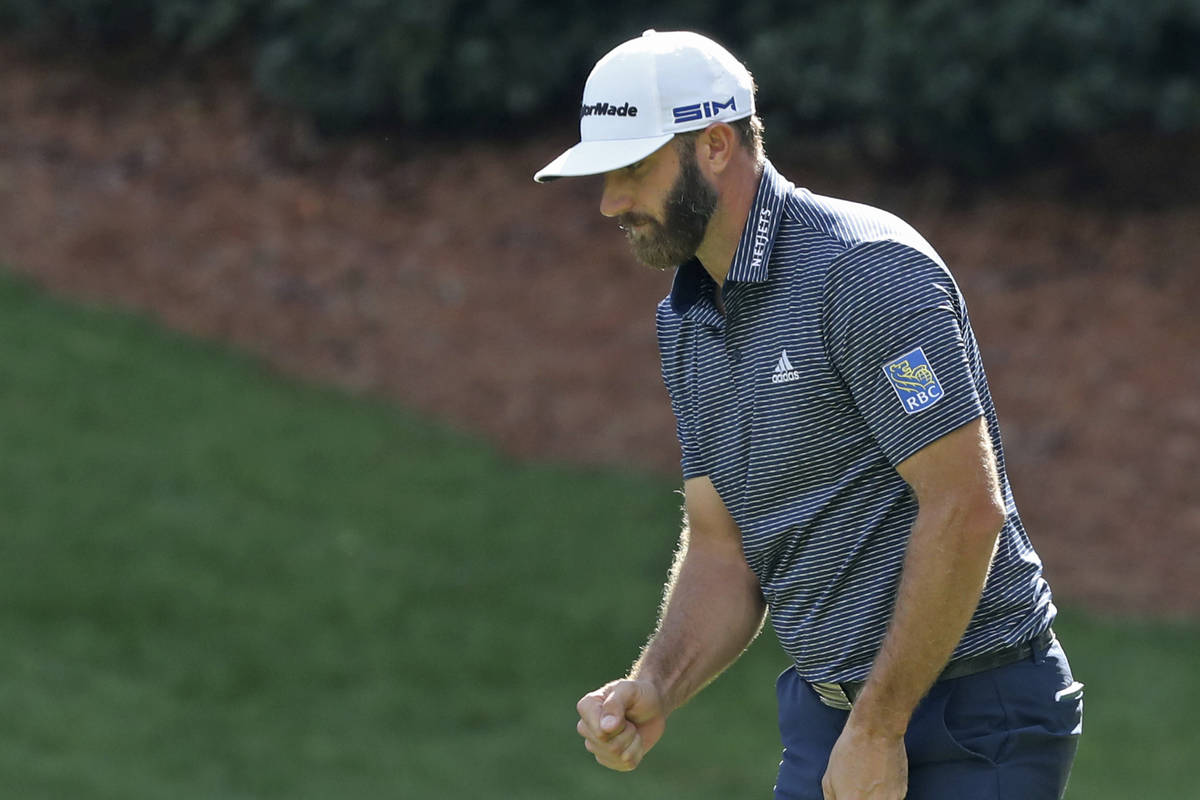 Dustin Johnson reacts after a birdie on the 13th hole during the final round of the Masters gol ...