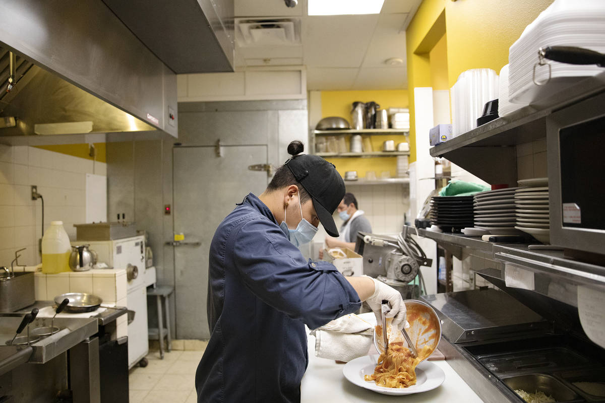 Chef Omar Velazquez plates a pasta dish in the kitchen at Pasta Shop Ristorante in Henderson, , ...