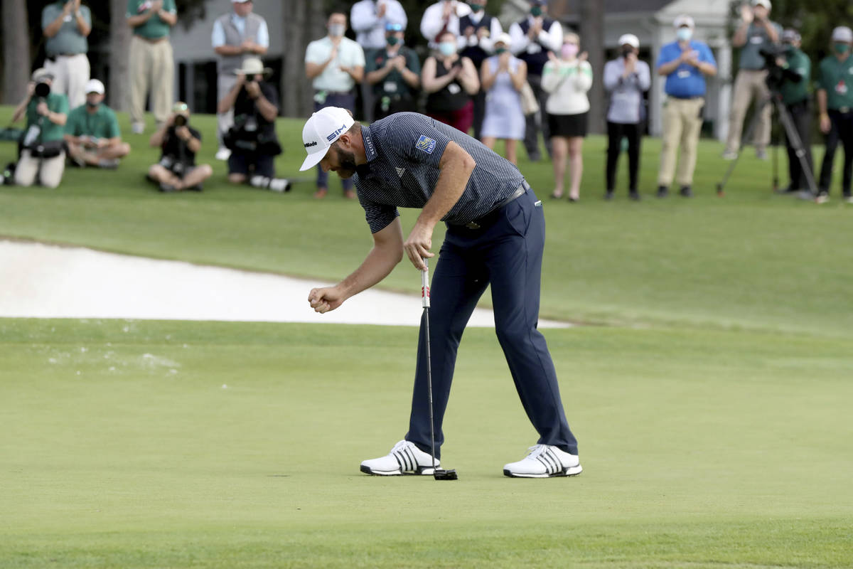 Dustin Johnson reacts after winning the Masters golf tournament Sunday, Nov. 15, 2020, in Augus ...