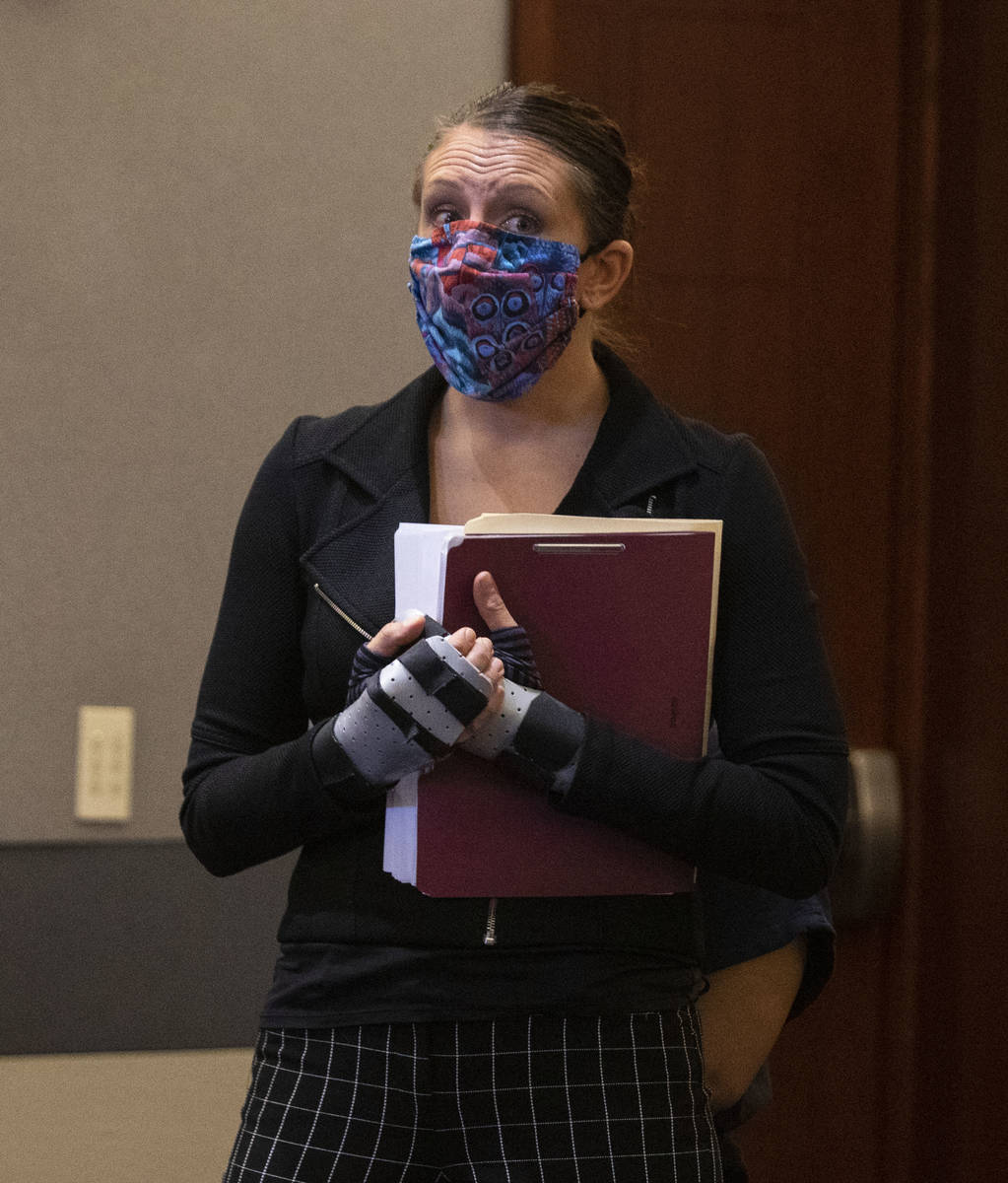 Attorney Sarah Hawkins shields her client, Amanda Sharp-Jefferson, charged with murder in conne ...