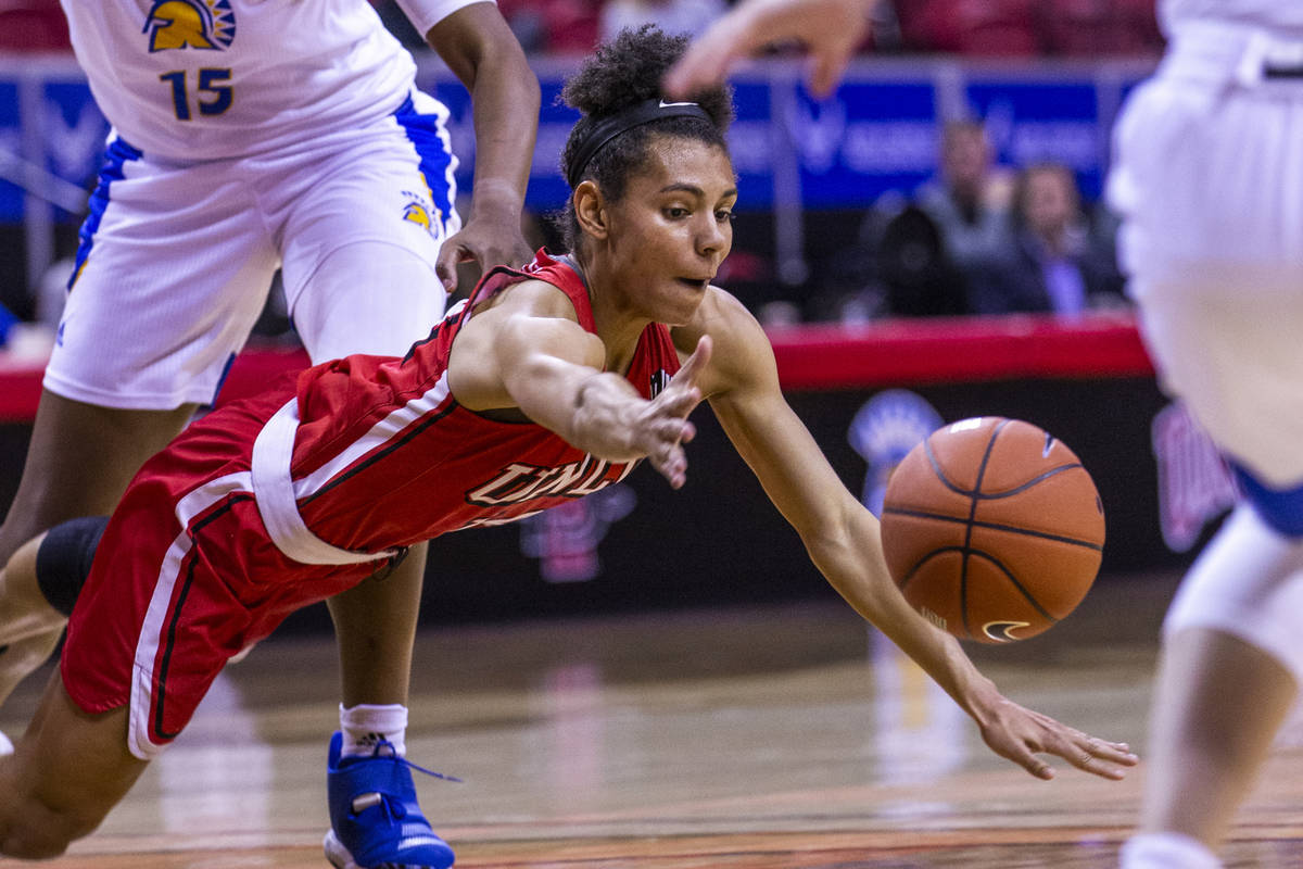 UNLV Lady Rebels guard Bailey Thomas (14, below) dives for a loose ball with San Jose State Spa ...