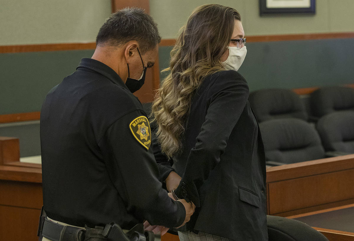 Lauren Prescia is escorted out of the courtroom after receiving her sentencing for the death of ...