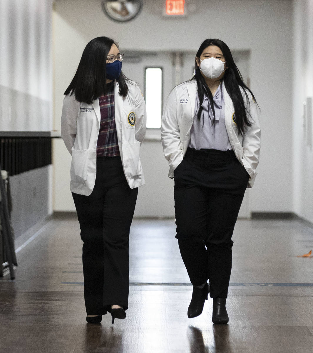 Toro University Nevada students, Stephanie Bernardo, left, and Kylie Zeng walk at their school, ...