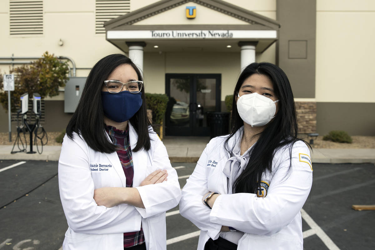 Toro University Nevada students, Stephanie Bernardo, left, and Kylie Zeng pose for a photo, on ...