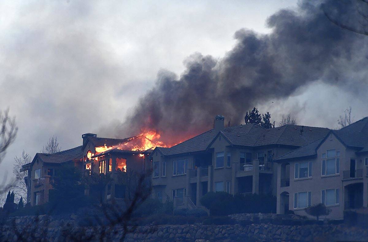 A large home burns during the Pinehaven Fire in the Caughlin Ranch area of Reno on Tuesday, Nov ...