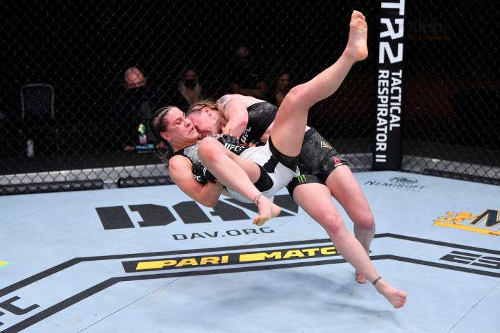 (R-L) Valentina Shevchenko of Kyrgyzstan takes down Jennifer Maia of Brazil in their women's f ...