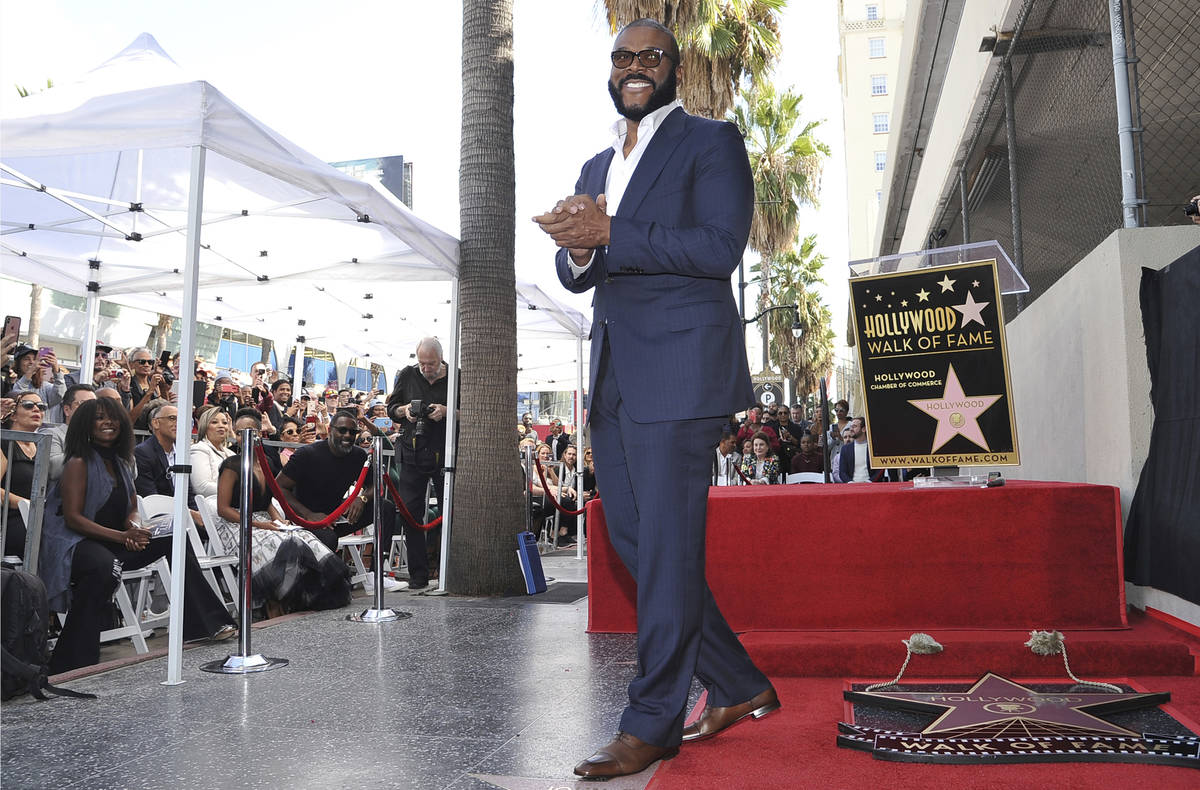 FILE - Filmmaker/actor Tyler Perry, known for the "Madea" films, appears during a ceremony hono ...