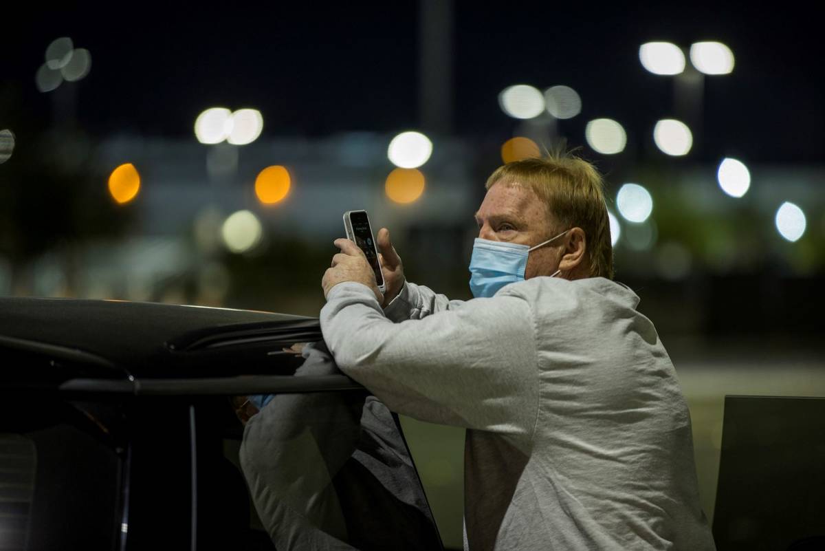 Raiders owner Mark Davis looks on as the team prepares to honor the Las Vegas shooting victims ...