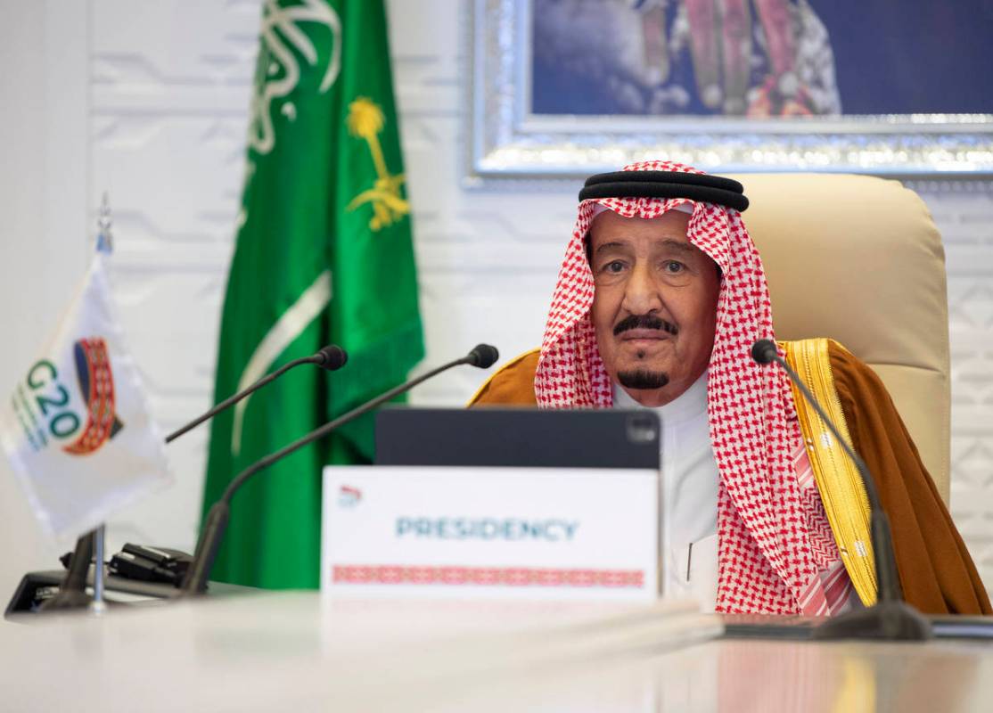 In this handout image provided by Saudi Royal Palace, Saudi King Salman gives his opening remar ...