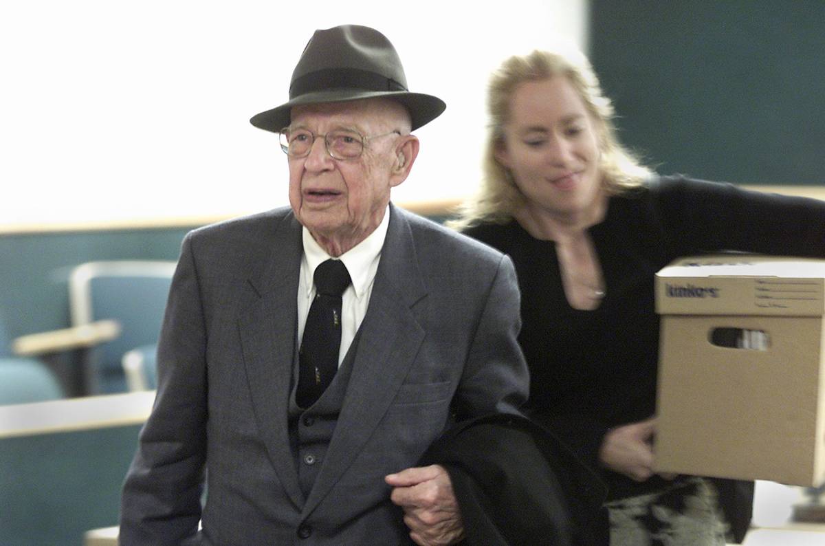 Dr. Quincy Fortier leaves the courtroom with his daughter, Nanette, after a settlement was reac ...