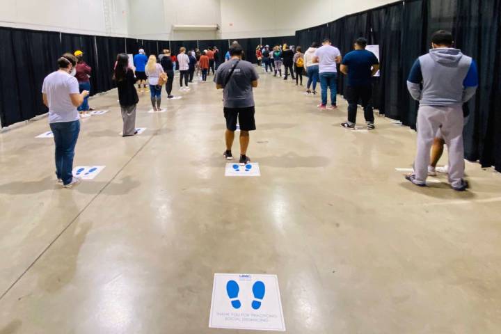 People wait in line for COVID-19 testing offered at Cashman Center on Wednesday, Nov. 18, 2020, ...