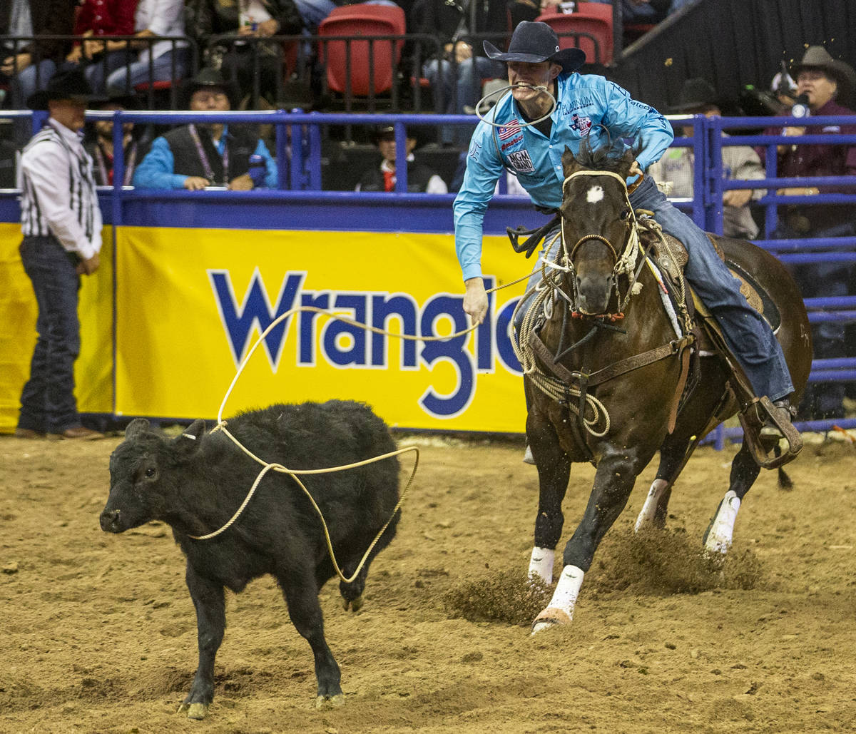 Tuf Cooper of Decatur, Texas, eyes his steer in Tie-Down Roping at the tenth go round of the Wr ...