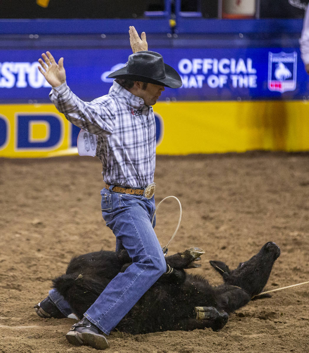 Adam Gray of Seymour, Texas, in Tie-Down Roping at the tenth go round of the Wrangler National ...