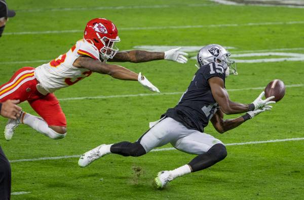 Las Vegas Raiders wide receiver Nelson Agholor (15) makes a diving attempt at a long pass as Ka ...