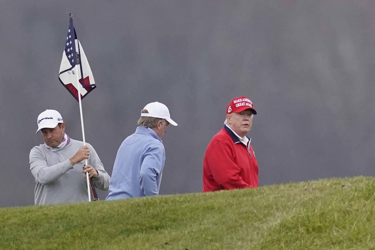 President Donald Trump plays golf at Trump National Golf Club, Friday, Nov. 27, 2020, in Sterli ...