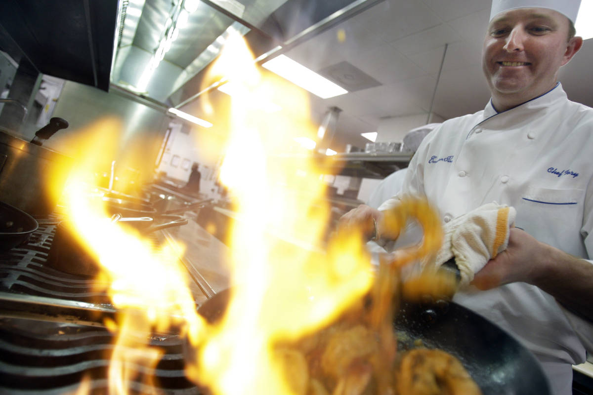 In this Wednesday, Jan. 7, 2009 file photo, Executive Chef Tory McPhail cooks Lemon and Garlic ...