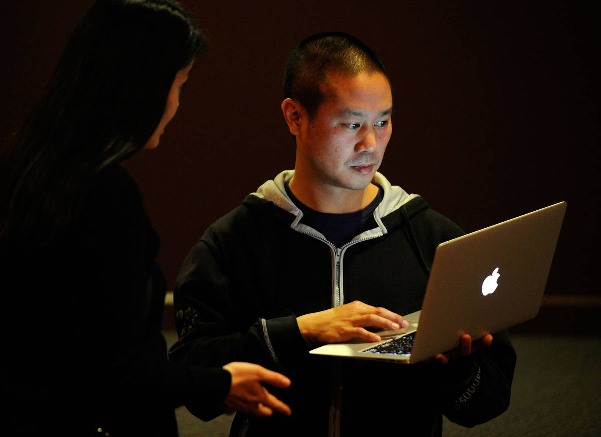 Zappos CEO Tony Hsieh works on his laptop computer before the start of the LaunchUp Las Vegas e ...