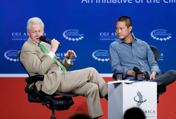 In this June 25, 2014, file photo, former President Bill Clinton, left, speaks with Zappos.com ...