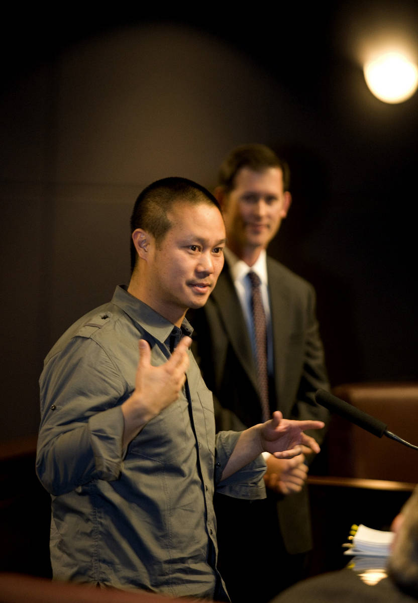 Tony Hsieh, left, CEO of Zappos a subsidiary of Amazon.com, speaks to members of the Las Vegas ...