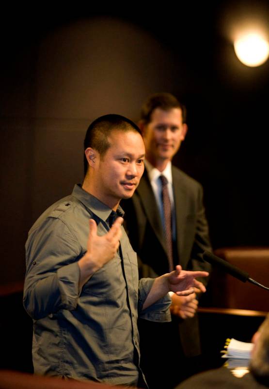 Tony Hsieh, left, CEO of Zappos a subsidiary of Amazon.com, speaks to members of the Las Vegas ...
