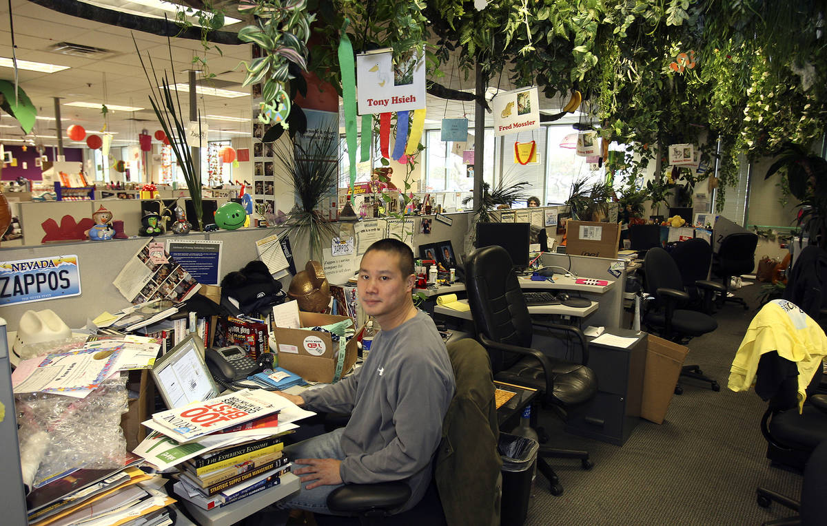 Zappos CEO Tony Hsieh works at his desk in an area called The Jungle, Friday Jan. 23, 2009. ...