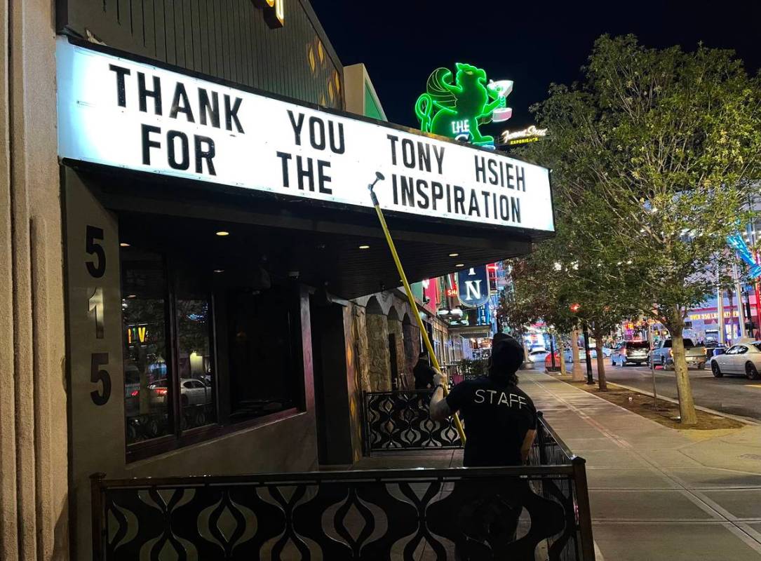 Chris Snook, manager at Corduroy on East Fremont Street, creates a message honoring Tony Hsieh ...