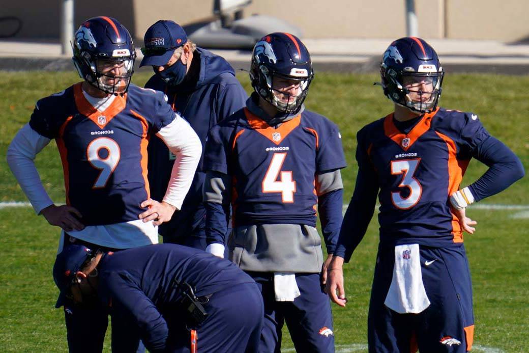 Denver Broncos quarterbacks Drew Lock, Brett Rypien and Jeff Driskel, from right, watch during ...