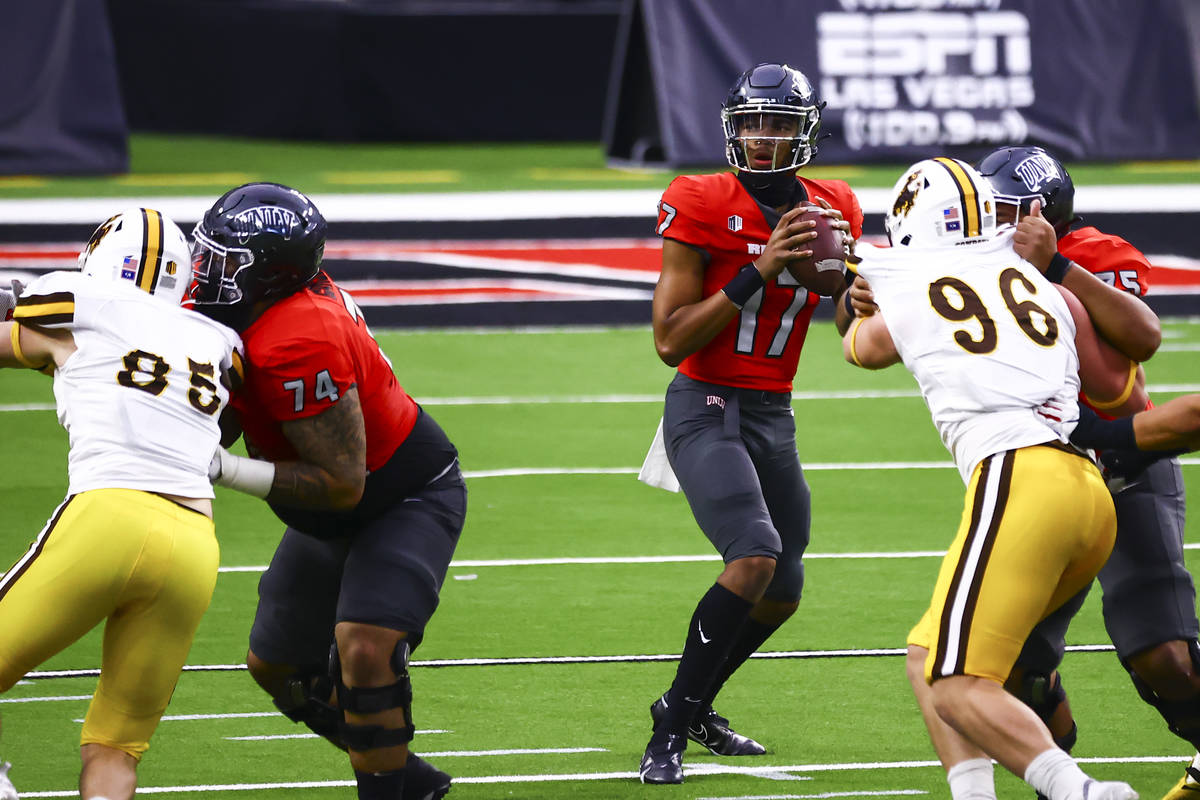 UNLV Rebels quarterback Doug Brumfield (17) looks to throw a pass against the Wyoming Cowboys d ...