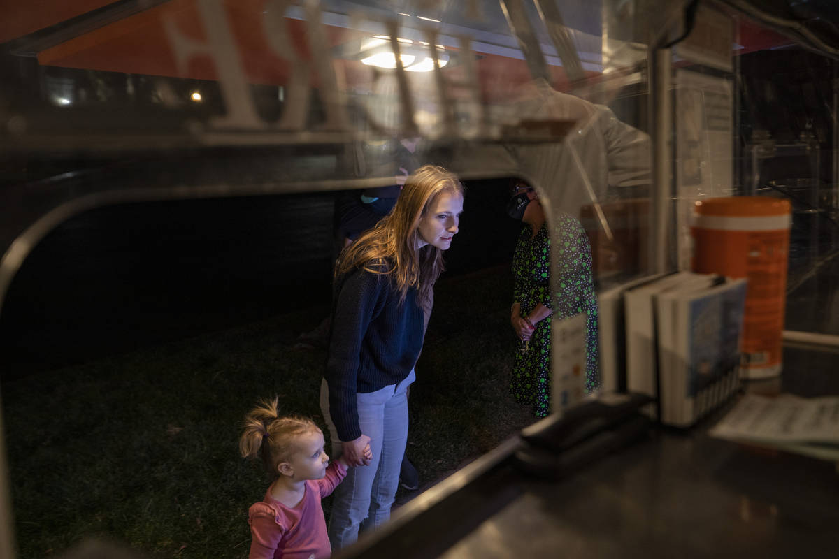 Charlie Freimanis, 2, and Ella Freimanis, of Las Vegas, figure out what they want on the YourPa ...