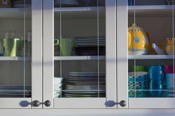 The placement of dishes and glassware in kitchen cabinets should be within reach. (Getty Images)