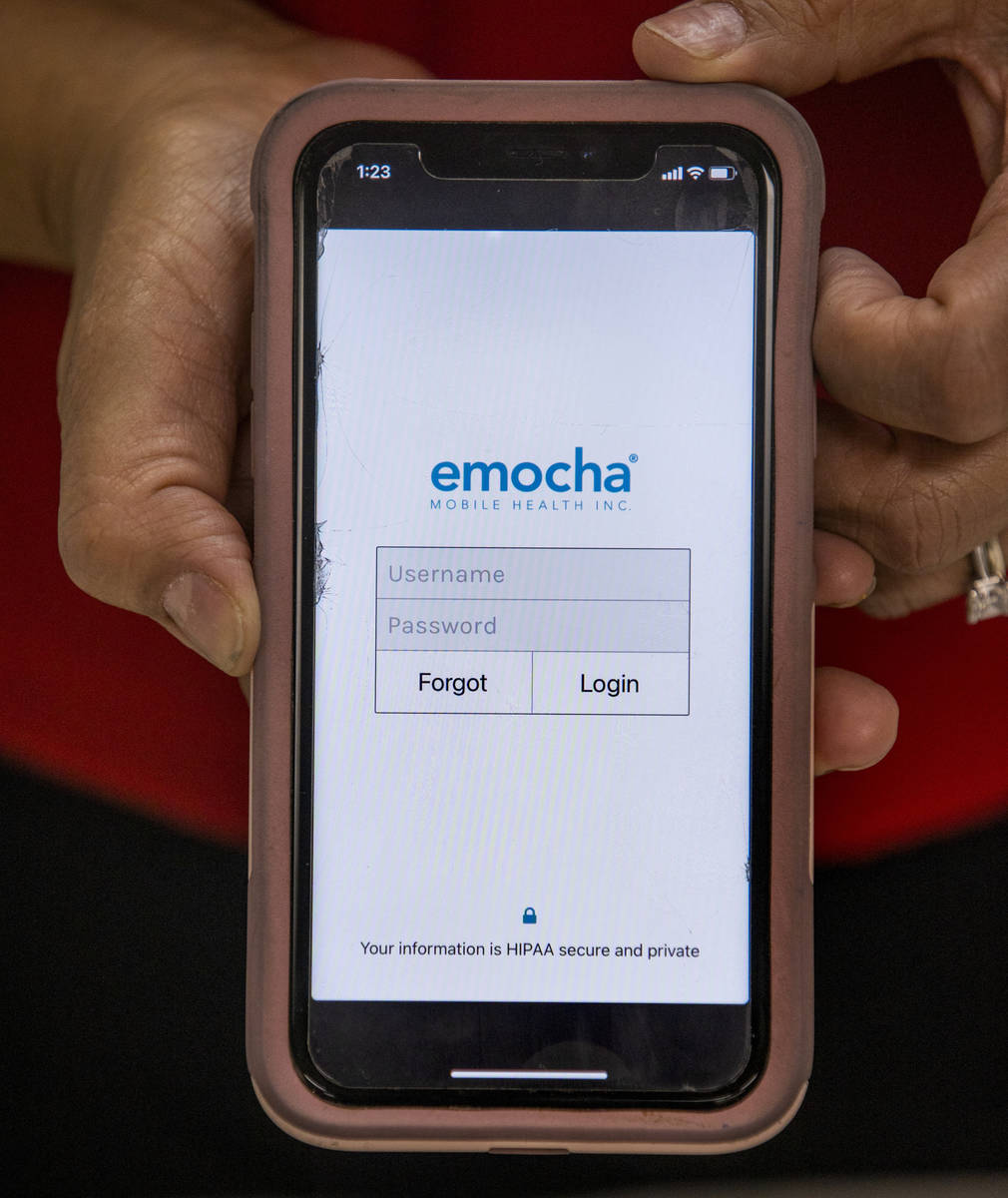 Clark County Education Association President Marie Neisess with the emocha app on her phone whi ...