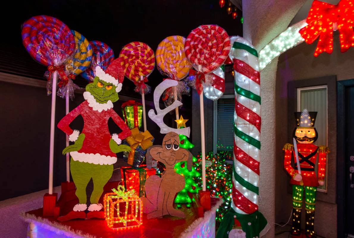 The Grinch Who Stole Christmas was part of the holiday lights display in the yard of Maria and ...