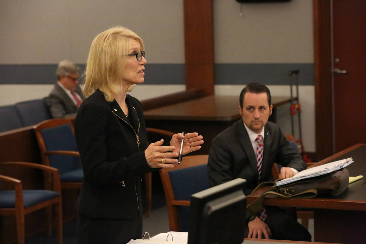 Samuel Warren, right, listens as Alice Denton addresses District Judge Gloria Sturman on March ...