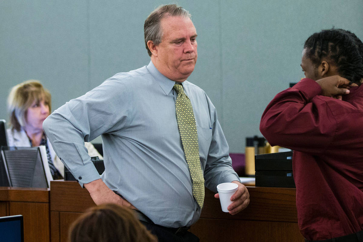 Defense attorney Bret Whipple, left, talks with Norman Smith in court at the Regional Justice C ...