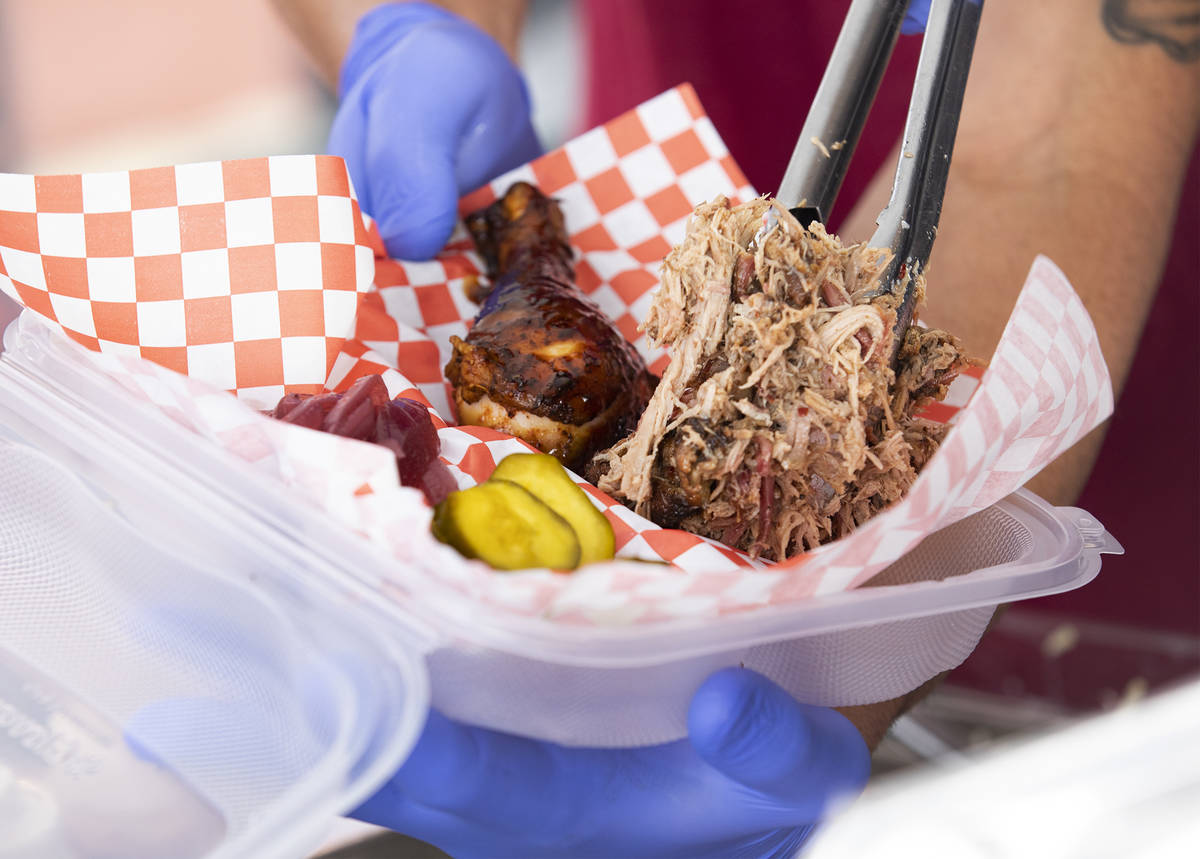 Sous-chef Myrhissa Bautista prepares a plate at the SoulBelly BBQ pop-up in the Arts District i ...