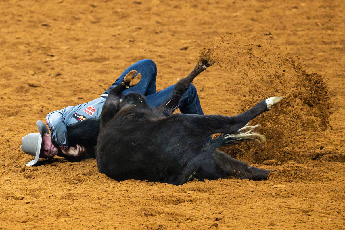 PRCA Steer Wrestling contestant Dakota Eldridge competes during the opening night of the Nation ...