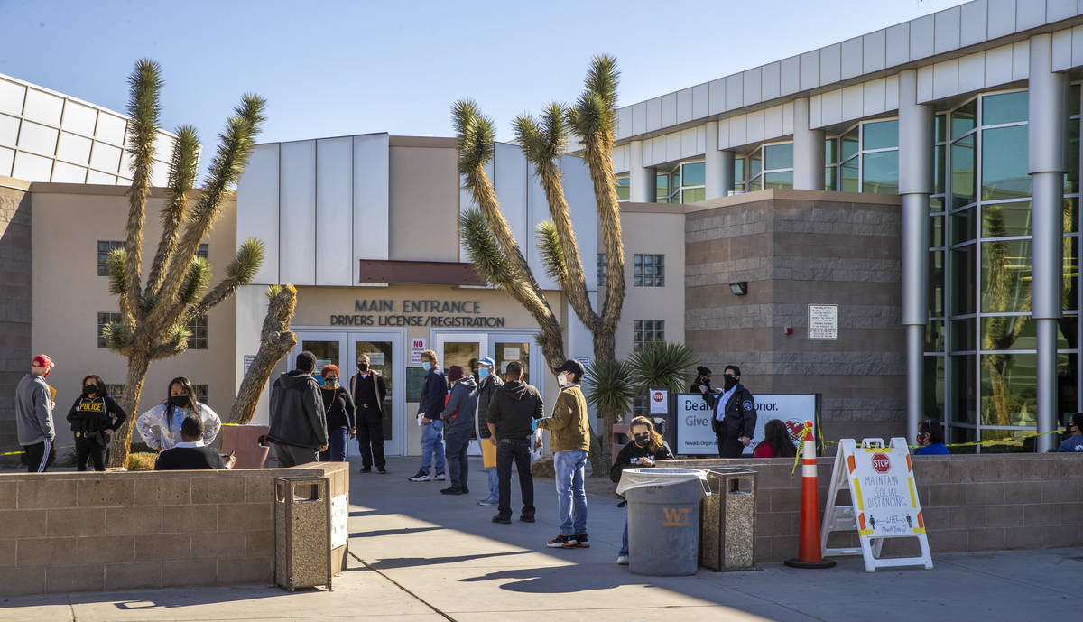 Long lines of people form regularly outside the Nevada Department of Motor Vehicles on West. Fl ...