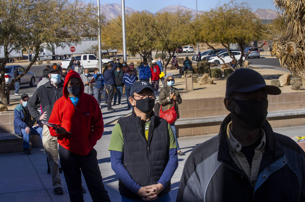 Long lines of people form regularly outside the Nevada Department of Motor Vehicles on West. Fl ...