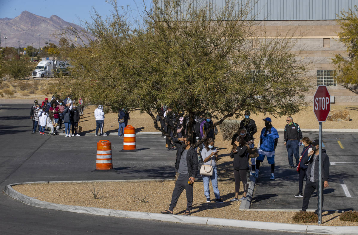 Long lines of people form regularly around the parking lot outside the Nevada Department of Mot ...