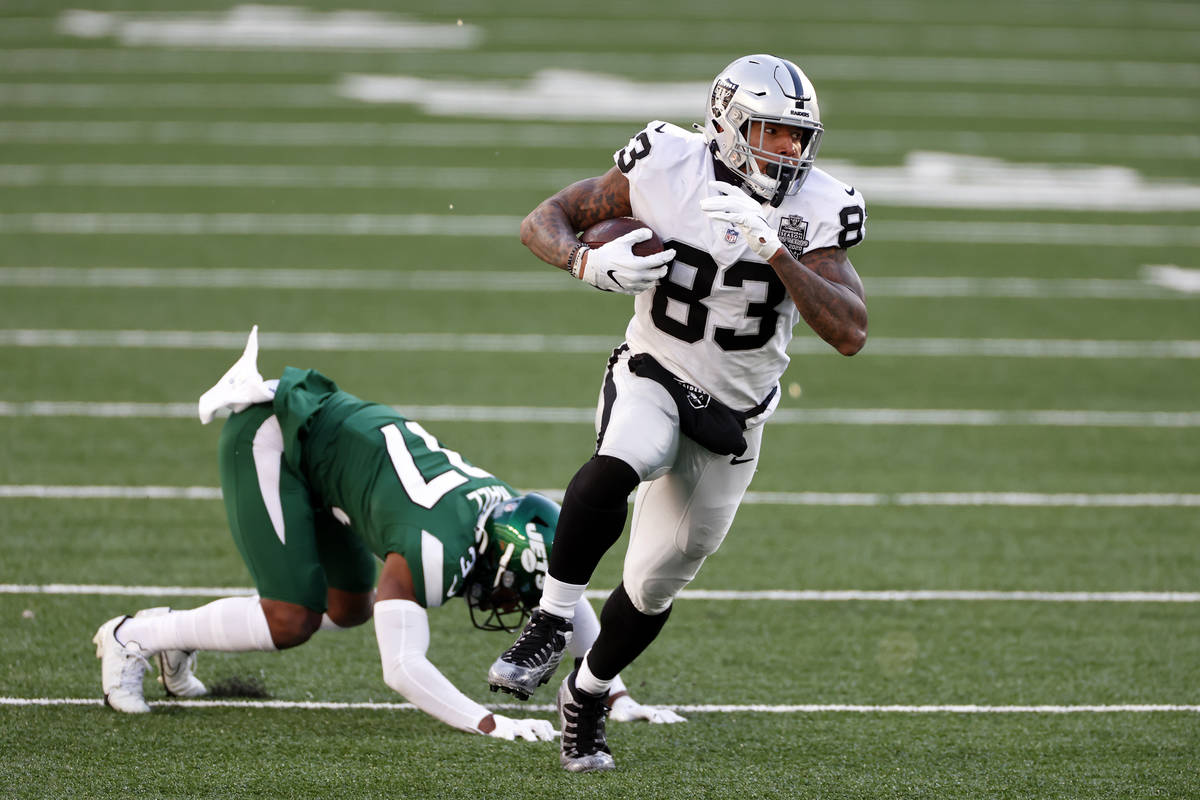 Las Vegas Raiders tight end Darren Waller (83) runs for a touchdown during an NFL football game ...