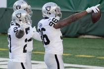 Las Vegas Raiders' Clelin Ferrell, right, celebrates a turnover with teammates during the first ...