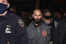 Mac's Public House co-owner Danny Presti is taken away in handcuffs after being arrested by New ...