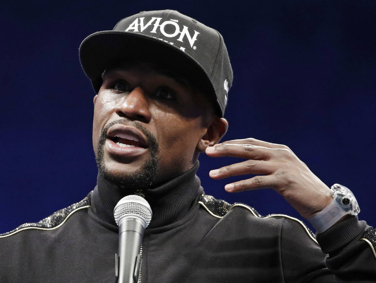 Floyd Mayweather Jr. speaks at a news conference after a super welterweight boxing match agains ...