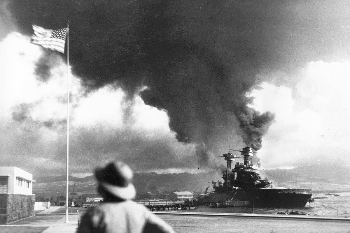 American ships burn during the Japanese attack on Pearl Harbor, Hawaii, on Dec. 7, 1942. (AP P ...